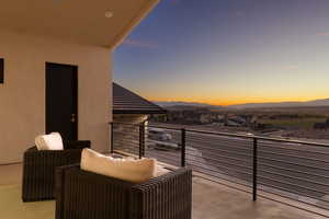 Balcony at dusk with a mountain view