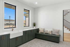 Interior space featuring a sink and recessed lighting