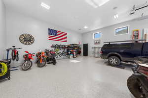 Garage featuring a garage door opener