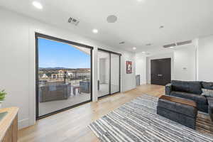 Living area with recessed lighting, light wood finished floors, and a mountain view