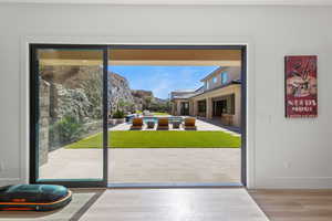 Doorway to outside featuring wood finished floors and a mountain view