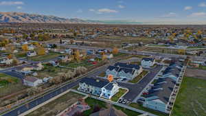 Aerial perspective of suburban area featuring a mountain backdrop