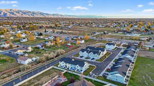 Aerial perspective of suburban area with a mountainous background