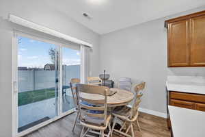 Dining area featuring a textured ceiling and dark wood-style floors