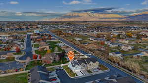 Aerial perspective of suburban area featuring a mountainous background