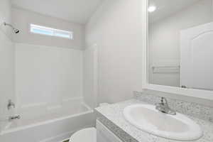 Full bathroom with vanity and washtub / shower combination