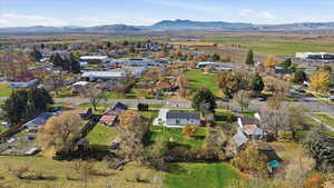 View of property location featuring a mountain backdrop and nearby suburban area