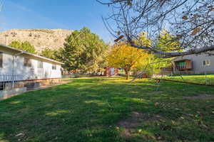 Fenced backyard with a storage unit