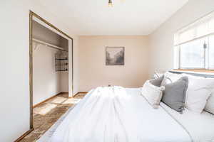 Bedroom #1 featuring a closet and stone finish flooring
