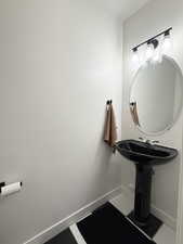 Bathroom featuring baseboards