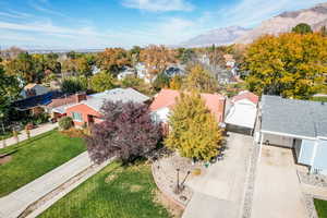 Aerial perspective of suburban area with a mountain backdrop