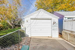 Garage with concrete driveway