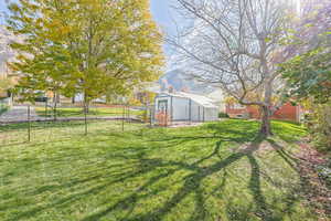 View of yard with an outbuilding