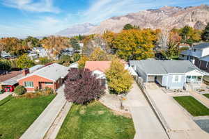 Aerial perspective of suburban area featuring a mountainous background