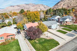 Aerial perspective of suburban area featuring a mountain backdrop