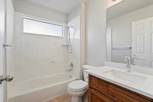 Bathroom featuring vanity and bathing tub / shower combination