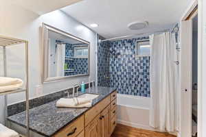 Full bathroom featuring vanity, and shower / bath combo