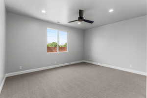 Spare room with light colored carpet, recessed lighting, and a ceiling fan