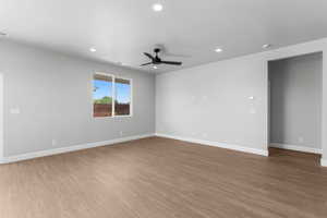 Empty room featuring recessed lighting, light wood-type flooring, and ceiling fan