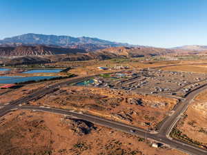 Aerial view of property's location with a water and mountain view