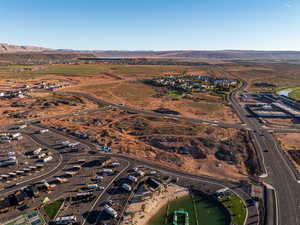 Aerial overview of property's location with a mountain backdrop and rural landscape