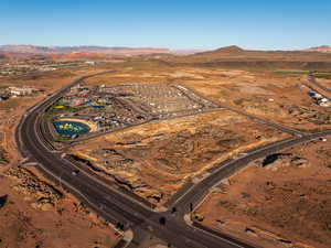 Aerial view of property and surrounding area featuring mountains and rural landscape