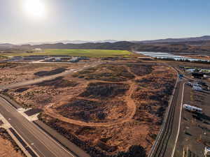 View of property location with a water and mountain view and a highway