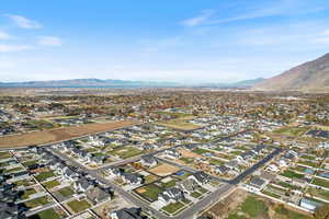 View of property location featuring mountains and nearby suburban area