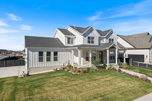 Modern farmhouse with covered porch, board and batten siding.