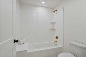 Full bathroom featuring  shower combination and toilet