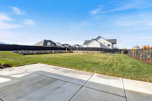 Fenced backyard with a patio area