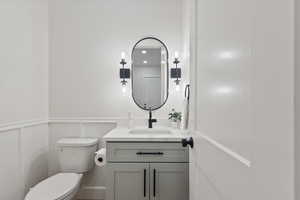 Bathroom featuring vanity and toilet