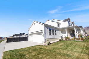Extra large garages that fits 3 cars with extra room and RV parking on the side.