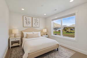 Bedroom with recessed lighting and carpet