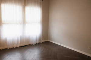 Unfurnished room with baseboards