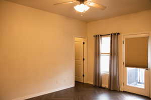Unfurnished room with baseboards and a ceiling fan
