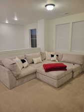 Living room featuring carpet floors and a textured ceiling