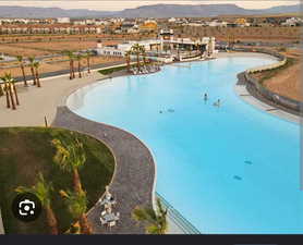 Community pool with a mountain view
