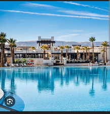 Community pool with a mountain view