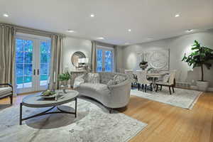Living room with french doors, recessed lighting, and light wood-type flooring