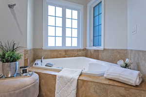 Full bathroom featuring a bathtub