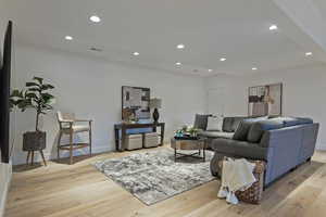 Living room featuring recessed lighting and light wood-style floors