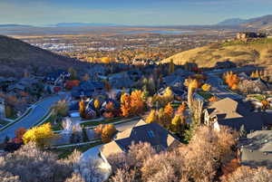 Aerial view of residential area featuring a mountainous background