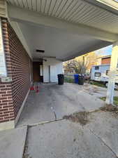 View of patio with a carport