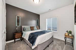 Bedroom 2 with carpet and baseboards
