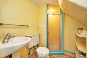 Full bath featuring a stall shower and tile patterned flooring