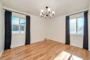 Unfurnished room with light wood-style flooring and plenty of natural light