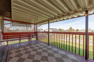 Wooden terrace with a lawn