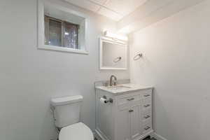 Half bath featuring vanity and a paneled ceiling