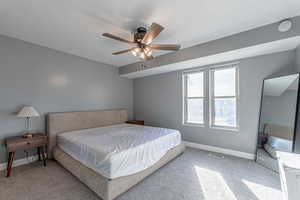 Master bedroom featuring baseboards and a ceiling fan